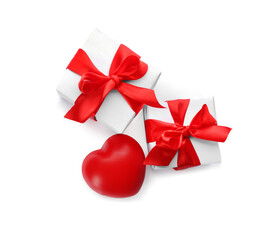 Gift boxes and red heart on white background, top view. Valentine's Day celebration