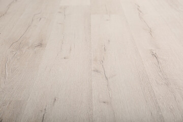 Light wooden laminate as background. Floor covering