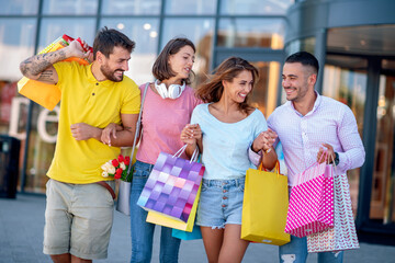 Group of young people after shopping in the city
