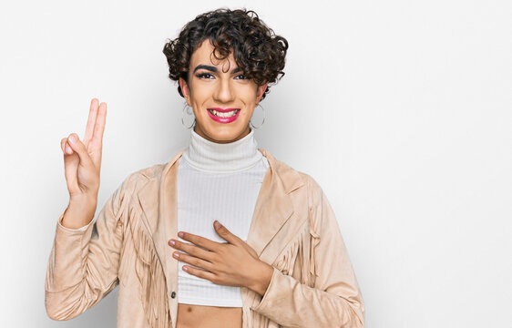 Handsome Man Wearing Make Up And Woman Clothes Smiling Swearing With Hand On Chest And Fingers Up, Making A Loyalty Promise Oath