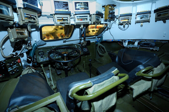 Driver-mechanic cabin of Ukrainian combat reconnaissance vehicle BRDM 2 : seat, wheel, dashboard