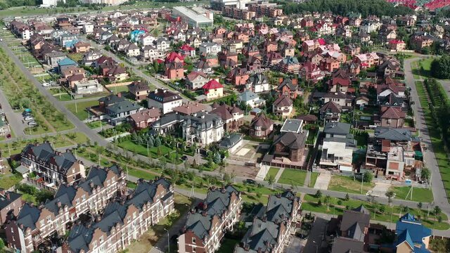 Top down aerial view of small houses in private residential area