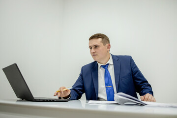 Workplace attorney success collar executive notary broker lawyer people corporate concept. Concentrated serious handsome pensive smart clever broker realtor recruiter using netbook at work