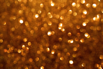 Golden brown bokeh background.  New Year, Christmas and all celebration background concept.