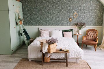 Basket with flowers in the bedroom on the bench
