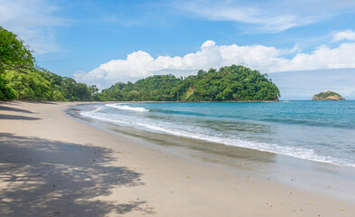 Manuel Antonio beatiful tropical beach with white sand and blue ocean. Paradise. National Park in Costa Rica, Central America.