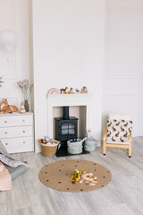 Child seat next to the fireplace in the room