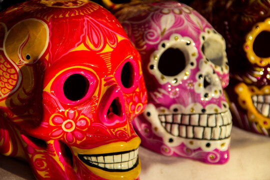 Calacas, wooden skull Day of the Dead masks on market in Cabo San Lucas, Mexico