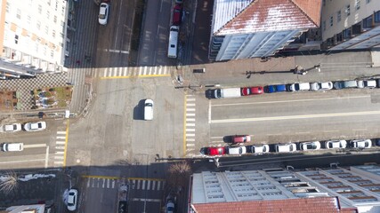 Aerial view of crosswalk and empty streets in quarantine days. sunlight seen through buildings. 