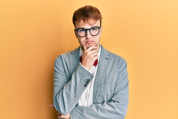 Young caucasian nerd man wearing glasses wearing hipster elegant look with bowtie serious face...