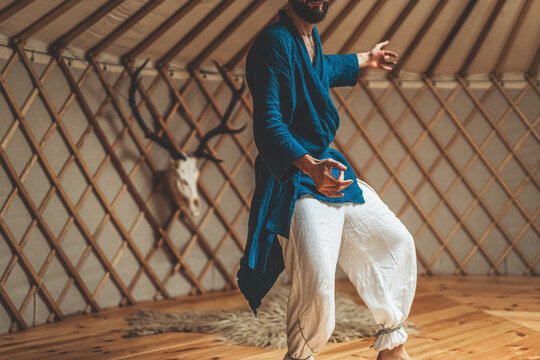 dancing warrior, ceremonial dance in a yurt.