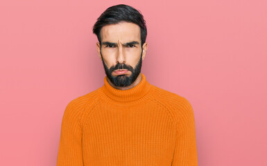 Young hispanic man wearing casual clothes depressed and worry for distress, crying angry and afraid. sad expression.