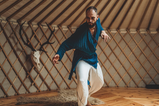 dancing warrior, ceremonial dance in a yurt.