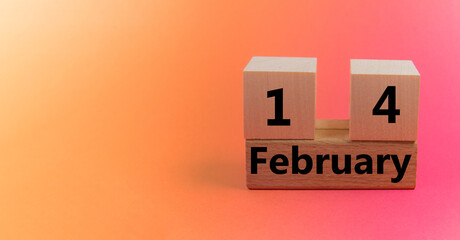 Gradient light orange pink background with wooden block calendar with date February 14 with copy space and space for your text