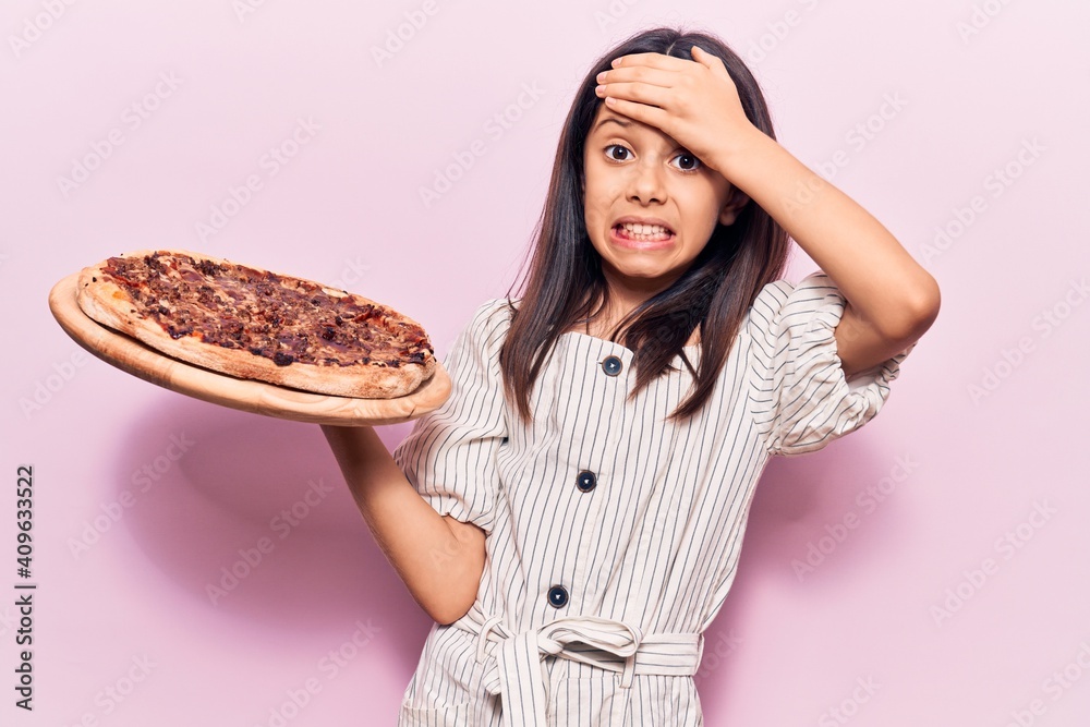 Canvas Prints Beautiful child girl holding italian pizza stressed and frustrated with hand on head, surprised and angry face