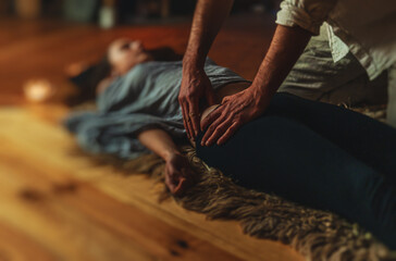 Masseur doing massage on woman body. Beauty concept.