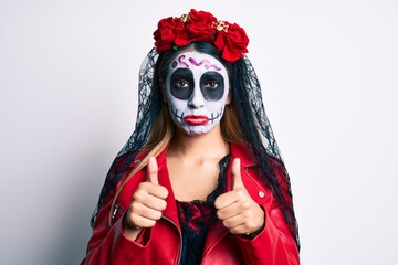 Woman wearing day of the dead costume with thumbs up doing ok sign depressed and worry for distress, crying angry and afraid. sad expression.