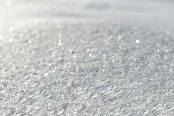 Obraz premium White snow texture on clear day. Winter background. Snow drifts. white snowflakes background, rough pattern of snow texture