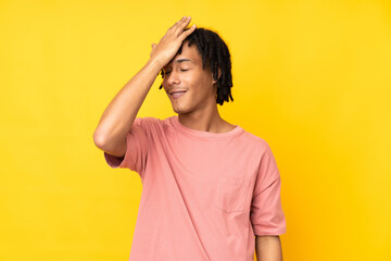 Young african american man isolated on yellow background has realized something and intending the...