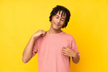 Young african american man isolated on yellow background with tired and sick expression