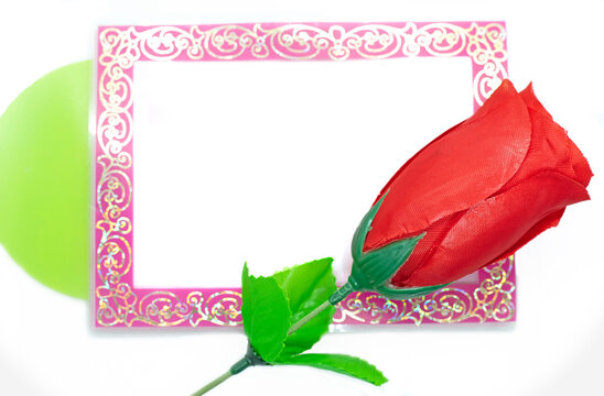 photo frame and red roses on white background, copy space