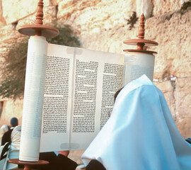 Lifting up the Torah scroll at the Western wall for Jewish holiday of Simchat Torah (Rejoicing with the Torah), following Sukkot (Feast of Tabernacles)  - obrazy, fototapety, plakaty