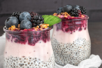 Chia pudding parfait with blackberries and blueberry smoothie and granola.