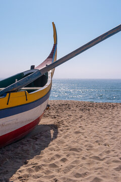 Arte Xavega typical portuguese old fishing boat on the beach in Paramos Espinho Portugal.