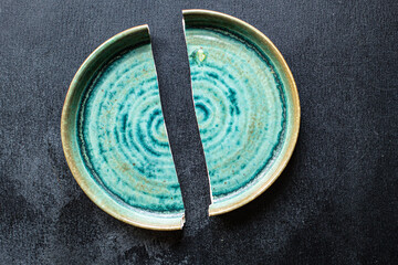 broken plate handmade ceramics dishes shards on the table