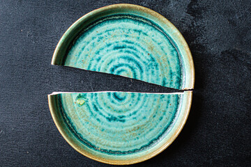 broken plate handmade ceramics dishes shards on the table
