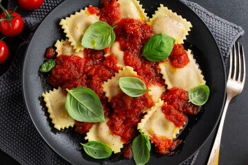 Ravioli with tomato sauce on plate