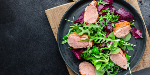 salad duck breast mix greens lettuce leaves ready to eat portion on the table for healthy meal...