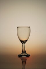 empty wine glass under back light