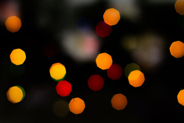 Bokeh christmas lights defocused on black background