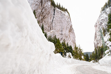 Fototapeta na wymiar Snowy road on winter canyon