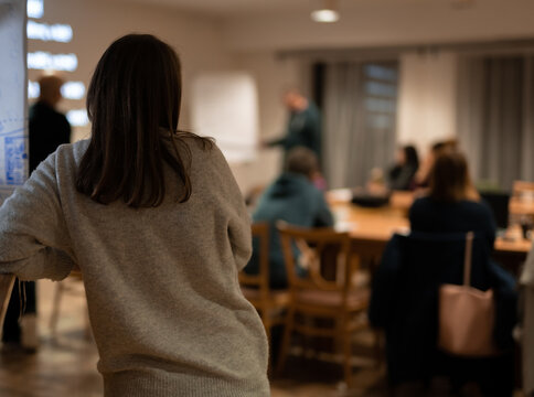 Woman From Behind Stay Watch And Listen During Meeting