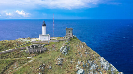 Fototapeta na wymiar Drone view from île de la Giraglia on the northern tip of Cap Corse, famous for its lighthouse and Genoese tower, both of which are historical monuments. Barcaggio village, Corsica, France