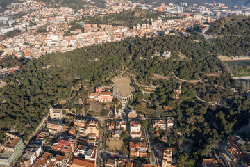 Aerial drone shot of Park Guell in Barcelona Hills in morning