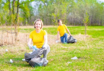 Volunteers clear the park from garbage. Volunteer and ecology concept