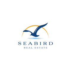 Seabird real estate logo design. Seagull luxury property template vector symbol. Sea Bird fly silhouette sign