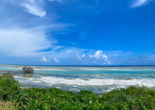 Panoramic view of low tide in Kiwengwa, Zanzibar. Blue sky. Copy space