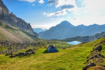  Wild camping in the swiss mountains with a view of the Seenalperseeli / mountain lake in the canton of uri. Enjoy the time in the beautiful nature