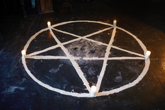 Magic circle with burning candles, nobody