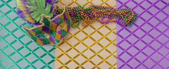 Mardi gras or carnival mask with beads on three color background. Venetian mask. © vetre