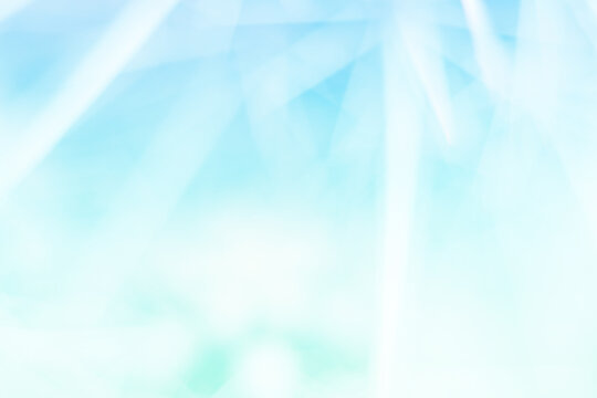 abstract blurred light blue background with rays