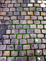 paved street, in shades of grey tending towards purple or pink, giving a romantic look to the square stones, perfect for a modern, industrial, cheerful, positive background