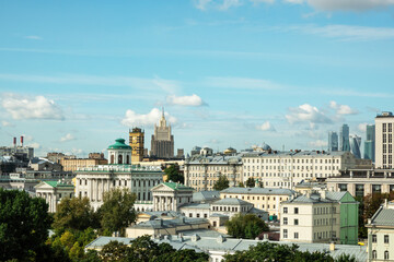 Panoramic top view of the historic center of Moscow city, Russia, against the background of the summer blue sky with white clouds.