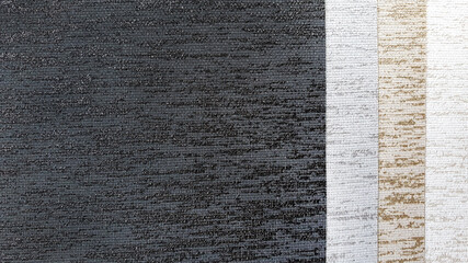 close up blind or curtain luxury fabric texture samples in black ,beige and white tone. textile fabric with sunproof function for home or office . interior material selection.