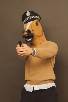 
horse man with gun and police cap