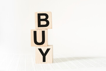 a word BUY on wooden cubes. business concept. business and Finance